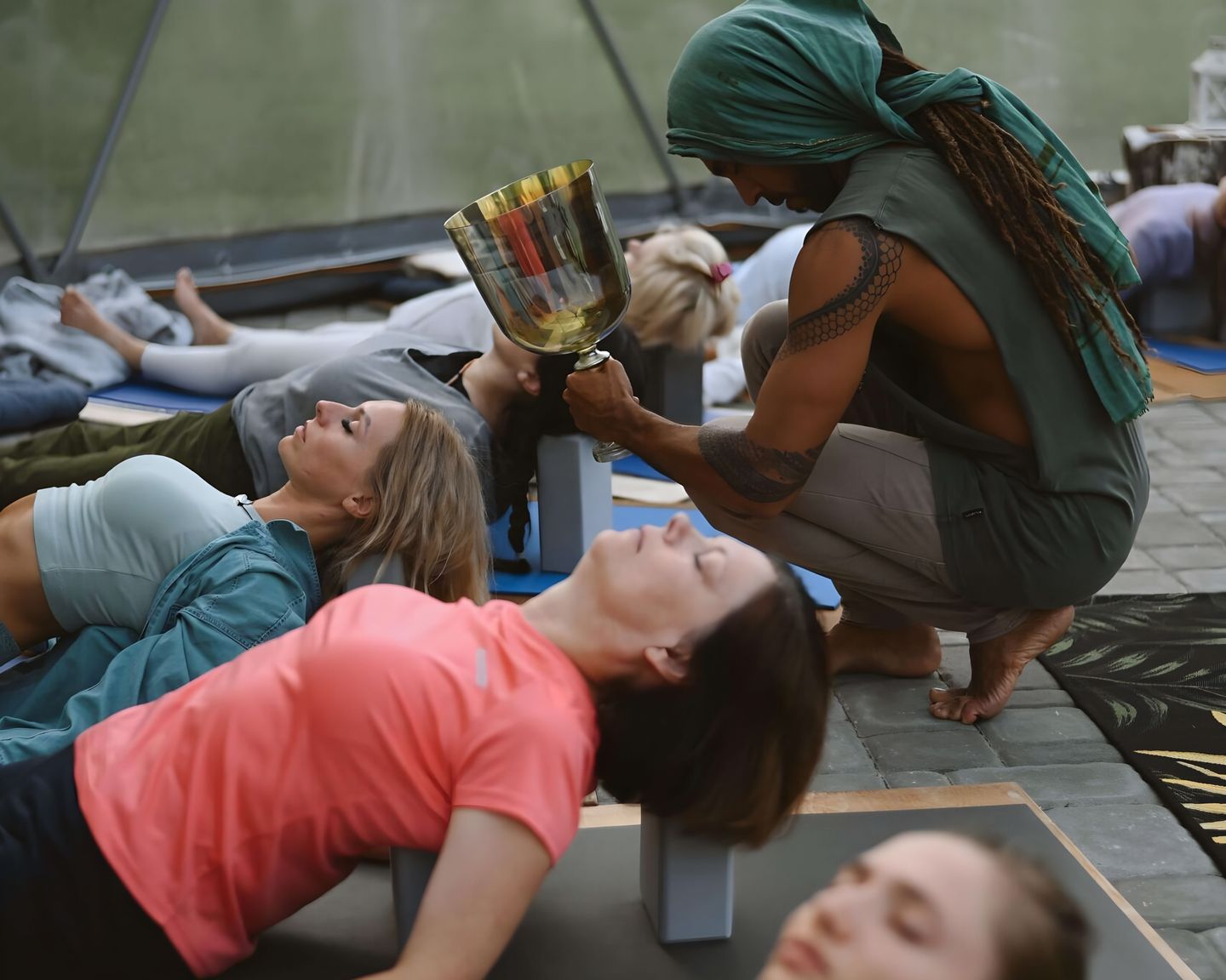 The teacher offering support during practice